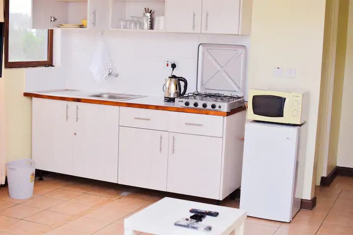 Furnished kitchen in Nairobi studio apartment